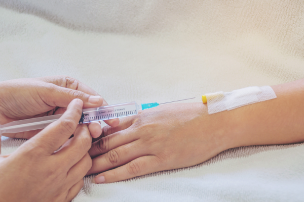 Iron IV therapy procedure through intravenous access to help treat low iron symptoms