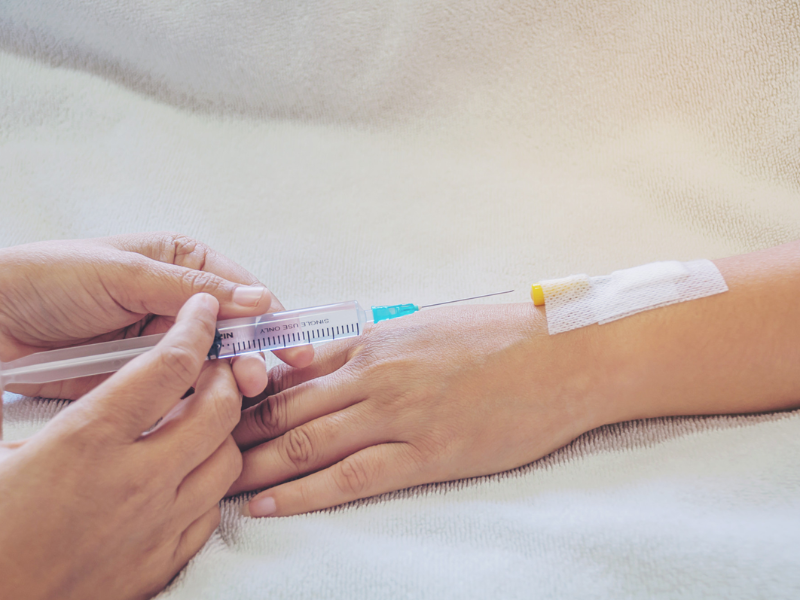 Iron IV therapy procedure through intravenous access to help treat low iron symptoms