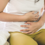 Person with stomach pain needing bali belly medication